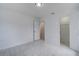 Bright bedroom with tile floors and spacious closet at 10237 Carrin Rd, Spring Hill, FL 34608