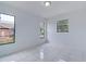 Bright bedroom with tile flooring and large windows at 10237 Carrin Rd, Spring Hill, FL 34608