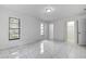 Bright bedroom with tile floors and spacious closet at 10237 Carrin Rd, Spring Hill, FL 34608