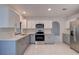 Renovated kitchen featuring stainless steel appliances and two-toned cabinetry at 10237 Carrin Rd, Spring Hill, FL 34608