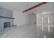 Spacious living room with a stone fireplace and high ceilings at 10237 Carrin Rd, Spring Hill, FL 34608