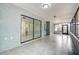 Spacious sunroom with tiled floors and access to backyard at 10237 Carrin Rd, Spring Hill, FL 34608