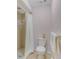 Simple bathroom with shower, toilet and white vanity at 11511 113Th St # 13H, Largo, FL 33778