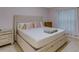 Spacious bedroom with king-size bed and ample storage at 11511 113Th St # 13H, Largo, FL 33778