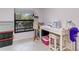 Bright craft room with sewing machine, work table, and storage at 11511 113Th St # 13H, Largo, FL 33778