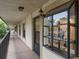 Hallway with a view of condo entrances and a balcony at 11511 113Th St # 13H, Largo, FL 33778