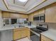 Kitchen with stainless steel appliances and wood cabinets at 11511 113Th St # 13H, Largo, FL 33778
