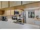 Kitchen view with stainless steel appliances and wood cabinets at 11511 113Th St # 13H, Largo, FL 33778