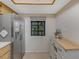 Kitchen corner with stainless steel appliances and wood cabinets at 11511 113Th St # 13H, Largo, FL 33778