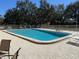 Community swimming pool with surrounding lounge chairs at 11511 113Th St # 13H, Largo, FL 33778