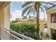 Balcony view of tropical landscaping and building exterior at 1200 Gulf Blvd # 204, Clearwater Beach, FL 33767