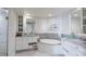 Spa-like bathroom with double sinks, a soaking tub, and walk-in shower at 1200 Gulf Blvd # 204, Clearwater Beach, FL 33767