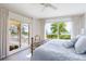 Ocean view bedroom with a light blue bedspread and balcony access at 1200 Gulf Blvd # 204, Clearwater Beach, FL 33767