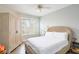 Bright bedroom with a wicker bed frame, built-in wardrobe, and plantation shutters at 1200 Gulf Blvd # 204, Clearwater Beach, FL 33767