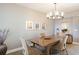 Bright dining room featuring a wooden table and neutral decor at 1200 Gulf Blvd # 204, Clearwater Beach, FL 33767