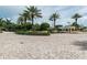 Landscaped courtyard entrance with brick paving and palm trees at 1200 Gulf Blvd # 204, Clearwater Beach, FL 33767