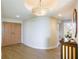Elegant entryway with hardwood floors and unique light fixture at 1200 Gulf Blvd # 204, Clearwater Beach, FL 33767
