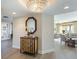 Entryway with view into living room, hardwood floors, and stylish console table at 1200 Gulf Blvd # 204, Clearwater Beach, FL 33767