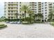 Building exterior with parking area and landscaping at 1200 Gulf Blvd # 204, Clearwater Beach, FL 33767