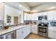 Modern kitchen with stainless steel appliances and granite countertops at 1200 Gulf Blvd # 204, Clearwater Beach, FL 33767