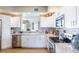 Bright kitchen featuring white cabinets and a stylish backsplash at 1200 Gulf Blvd # 204, Clearwater Beach, FL 33767