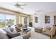 Bright living room with ocean view, comfortable seating, and built-in shelving at 1200 Gulf Blvd # 204, Clearwater Beach, FL 33767