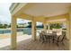 Relaxing patio area with table and chairs overlooking tennis court at 1200 Gulf Blvd # 204, Clearwater Beach, FL 33767