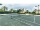Well-maintained tennis court with surrounding landscape at 1200 Gulf Blvd # 204, Clearwater Beach, FL 33767