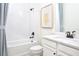 Clean bathroom with white subway tile, a bathtub and modern vanity at 12269 New Tranquility Path, Venice, FL 34293