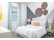 Charming bedroom with unique wall art and a comfortable bed at 12269 New Tranquility Path, Venice, FL 34293