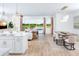 Open concept living and dining area with lake view at 12269 New Tranquility Path, Venice, FL 34293