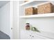 Bright laundry room with built in shelves and cabinets at 12269 New Tranquility Path, Venice, FL 34293