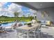 Inviting outdoor area with a pool, patio furniture, and serene landscape at 12269 New Tranquility Path, Venice, FL 34293