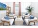 Cozy sitting area with four armchairs and a coffee table at 12269 New Tranquility Path, Venice, FL 34293