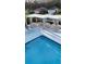 Community pool with covered seating area at 1604 Boswell Ln, New Port Richey, FL 34655
