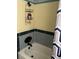 Small bathroom with penny tile and shower/tub combo at 16301 Redington Dr, Redington Beach, FL 33708