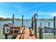Private dock with seating area and boat lift at 16301 Redington Dr, Redington Beach, FL 33708