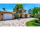 Two-story house with a large driveway and garage at 16301 Redington Dr, Redington Beach, FL 33708