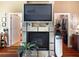 Fireplace with a large TV above and access to a walk-in closet at 16301 Redington Dr, Redington Beach, FL 33708