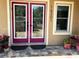 Front entrance with double doors and potted plants at 16301 Redington Dr, Redington Beach, FL 33708