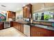 Kitchen with granite countertops and stainless steel appliances at 16301 Redington Dr, Redington Beach, FL 33708