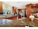 Spacious kitchen with granite counters and wood cabinets at 16301 Redington Dr, Redington Beach, FL 33708