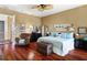 Spacious main bedroom with hardwood floors and a ceiling fan at 16301 Redington Dr, Redington Beach, FL 33708
