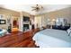 Main bedroom with hardwood floors, fireplace, and access to other rooms at 16301 Redington Dr, Redington Beach, FL 33708