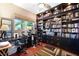 Home office with built-in bookshelves and desks at 16301 Redington Dr, Redington Beach, FL 33708