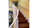 Wooden staircase with white metal railing at 16301 Redington Dr, Redington Beach, FL 33708