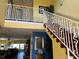 Elegant staircase with ornate railing leading to the second floor at 16301 Redington Dr, Redington Beach, FL 33708