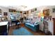 Bright studio with hardwood floors, art, and a comfy couch at 16301 Redington Dr, Redington Beach, FL 33708