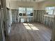 Unfinished studio with new wood-look tile flooring at 16301 Redington Dr, Redington Beach, FL 33708