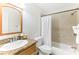 Clean bathroom with tub shower combo and granite vanity at 200 Country Club Dr # 802, Largo, FL 33771